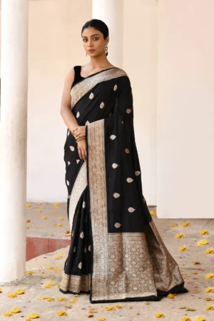 Jet black pure Banarasi katan silk saree handwoven with gold zari butas from Golden Muslin by Naaritva Banaras