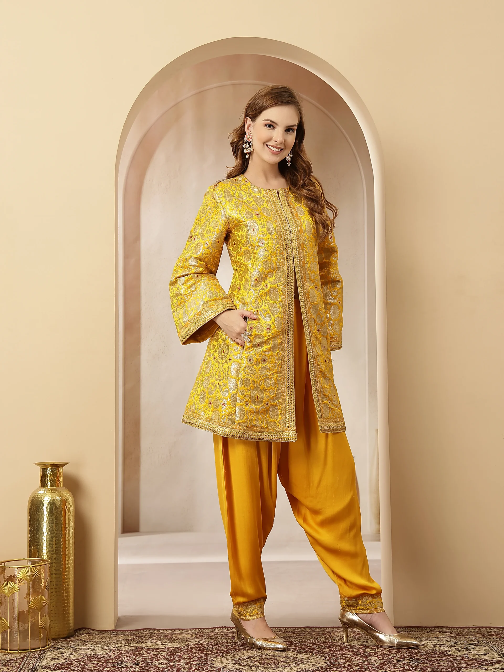 Mustard yellow embroidered jacket-style kurta with satin draped salwar from Golden Muslin By Soniya G