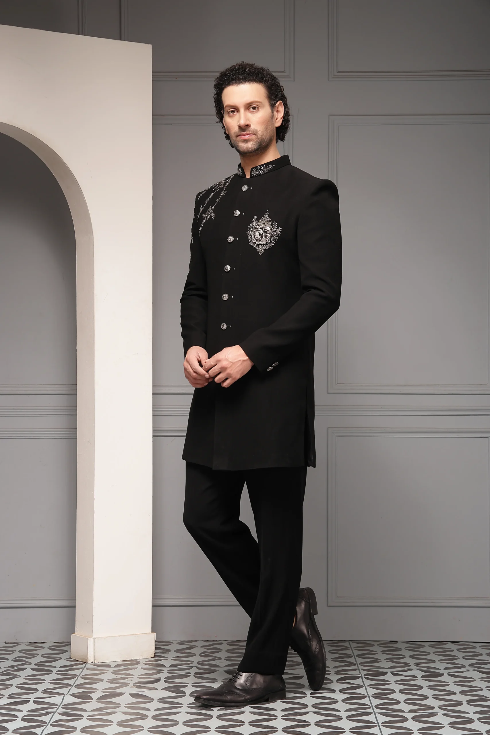 Black bandhgala set with silver crest embroidery and tailored trousers from Golden Muslin By Soniya G