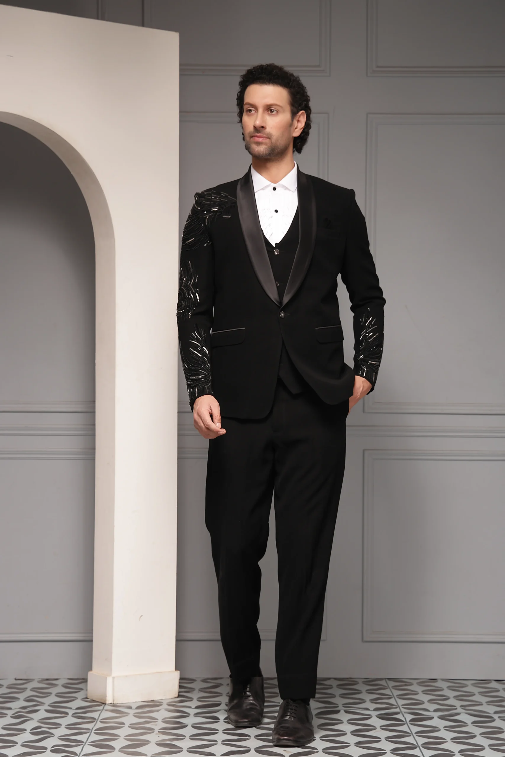 Commanding black tuxedo set with tonal embroidered sleeves from Golden Muslin By Soniya G