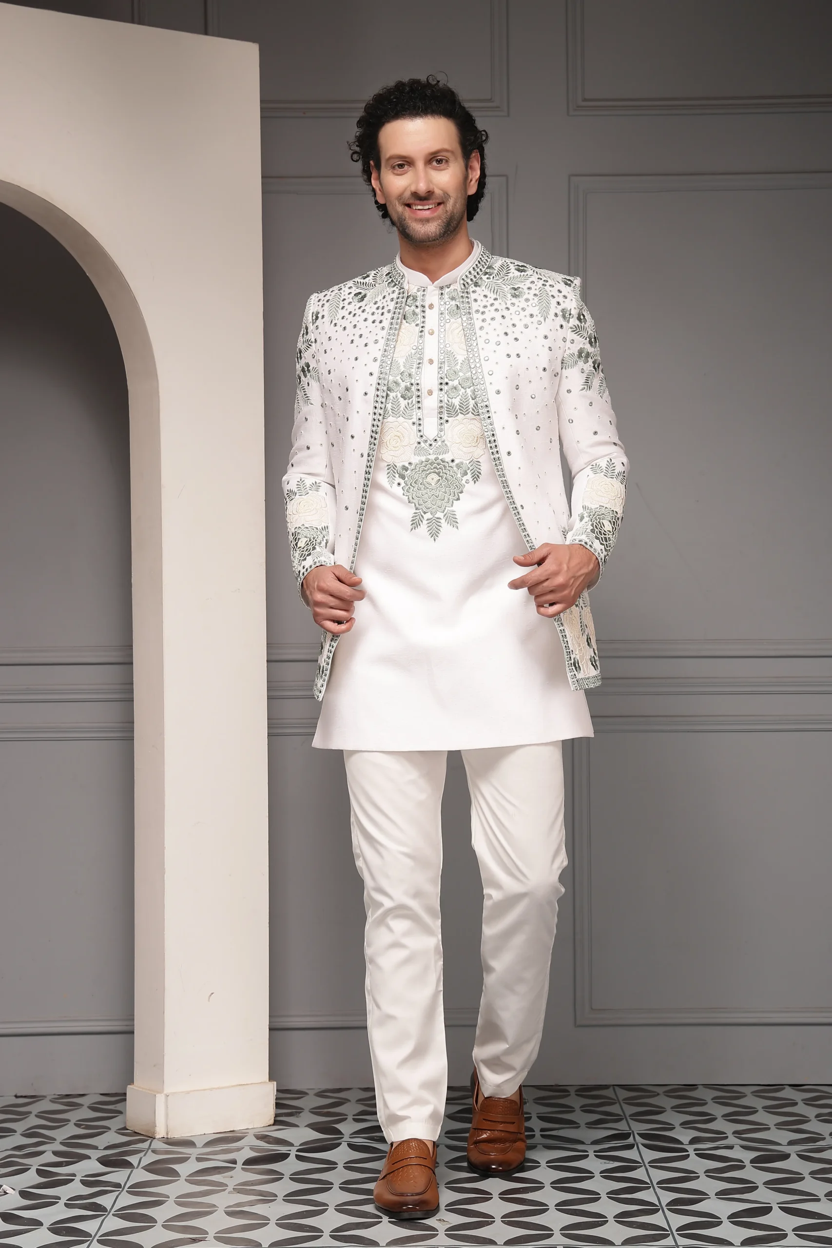 Ivory Kurta Set with Embroidered Nehru Jacket from Golden Muslin By Soniya G with floral threadwork and subtle sequin detailing
