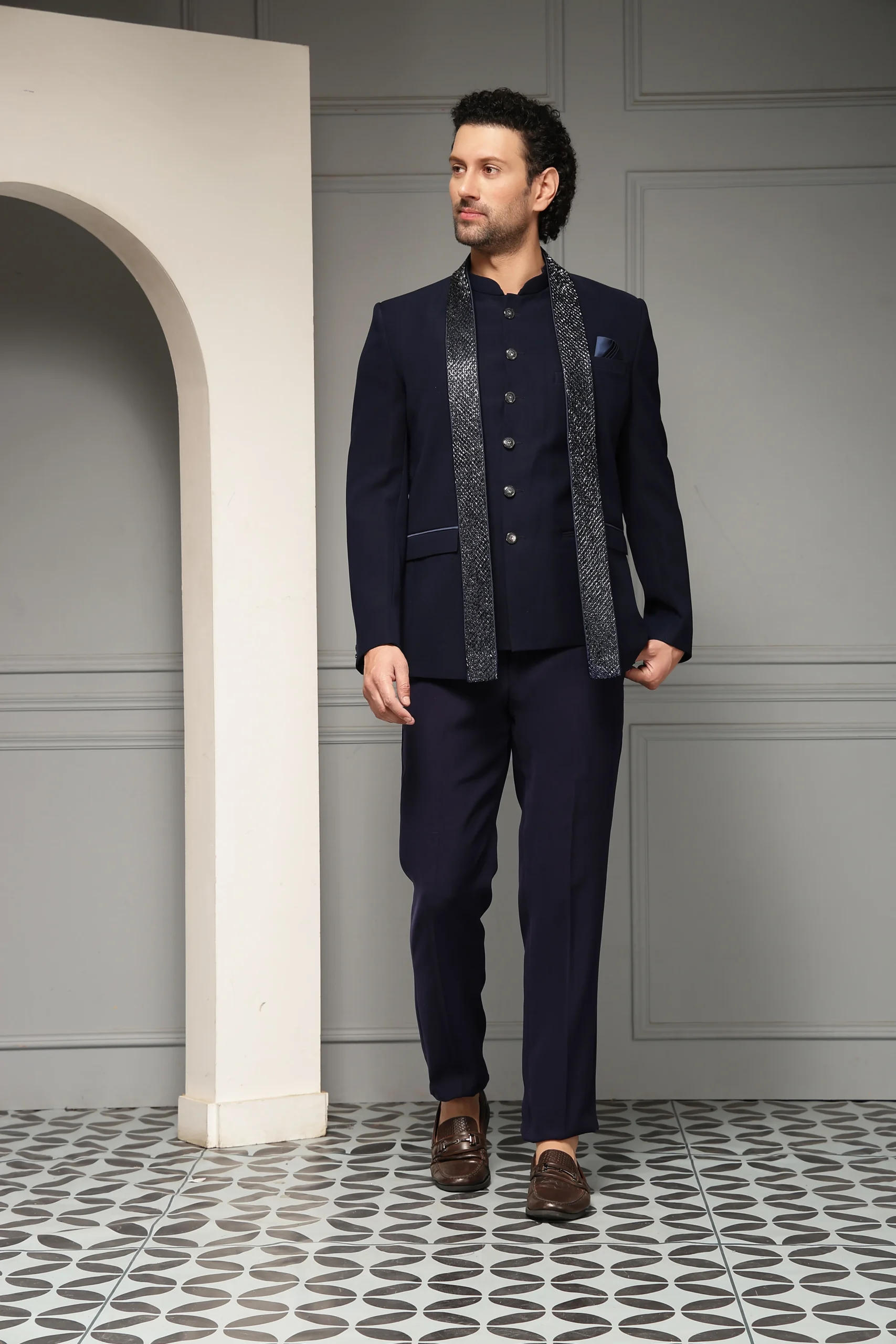 Navy blue bandhgala jacket with tailored trousers and matching stole from Golden Muslin By Soniya G