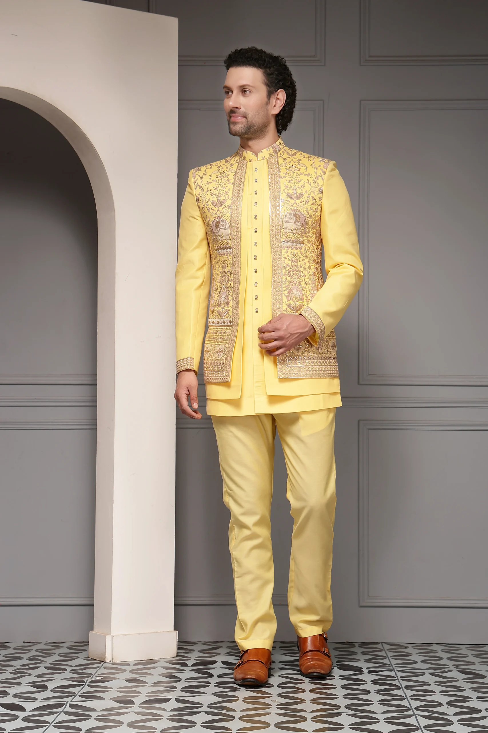 Yellow silk-blend embroidered bandhgala jacket with matching trousers from Golden Muslin By Soniya G