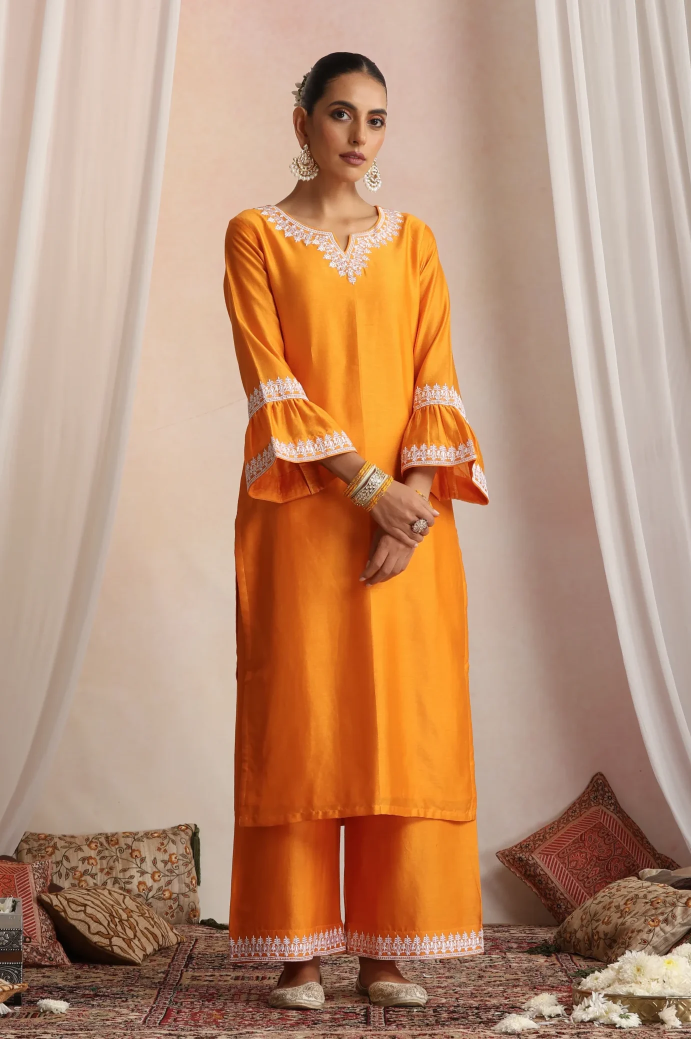Vibrant orange straight ethnic kurta set from Golden Muslin By Suikala