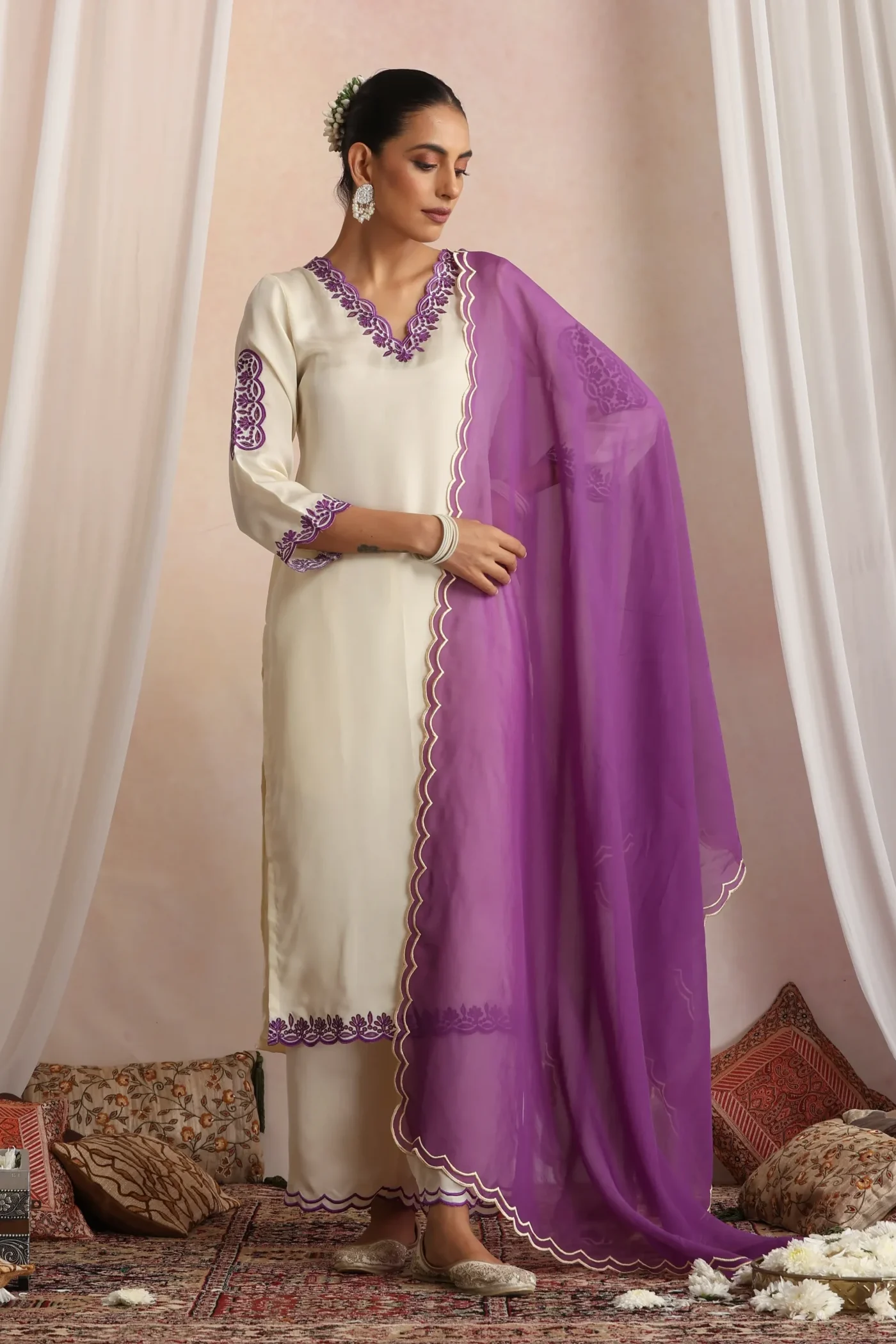 Ivory ethnic kurta set with purple embroidery and dupatta from Golden Muslin By Suikala