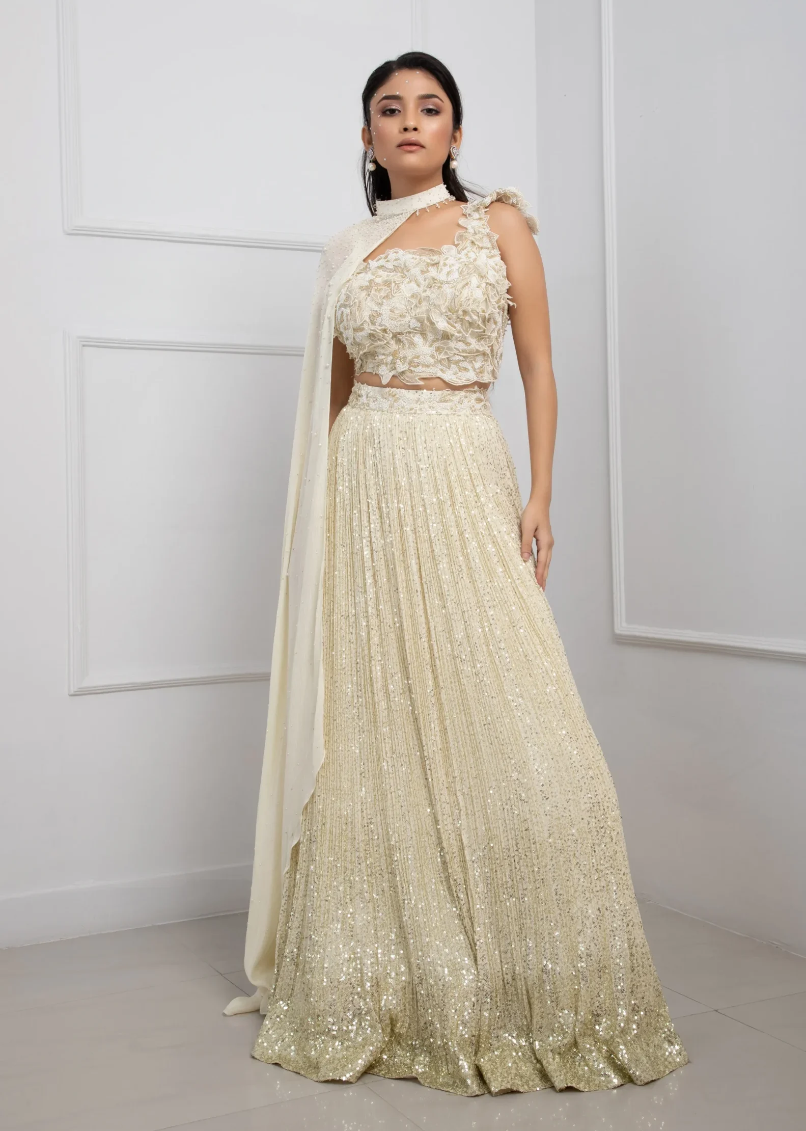 Ivory Chinon Embroidered Lehenga Set with 3D Floral Blouse and Cape from Golden Muslin By Anuj Agarwal