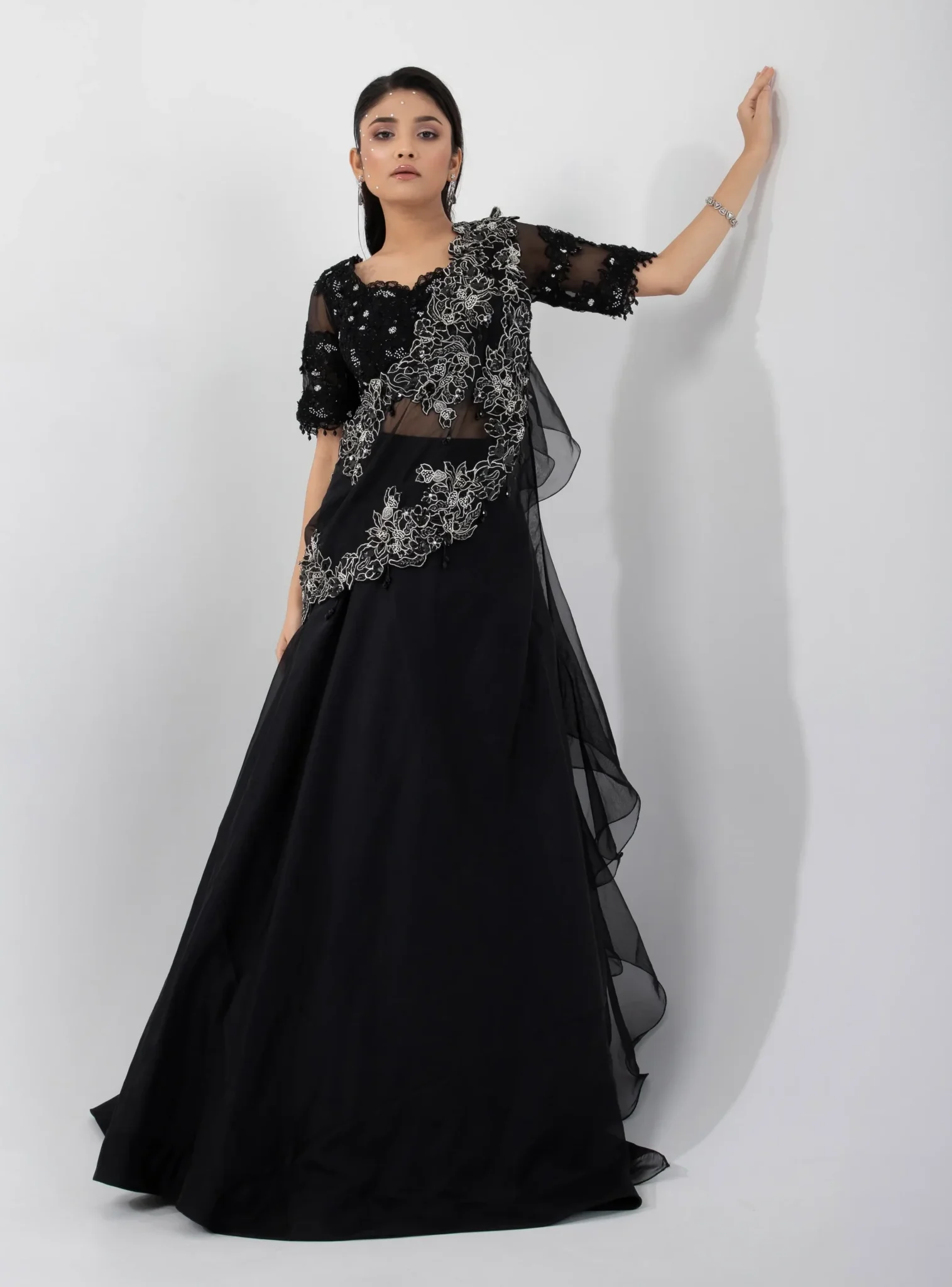 Black Chinon Lehenga Set with Ruffled Shoulder Drape and Embroidered Blouse from Golden Muslin By Anuj Agarwal