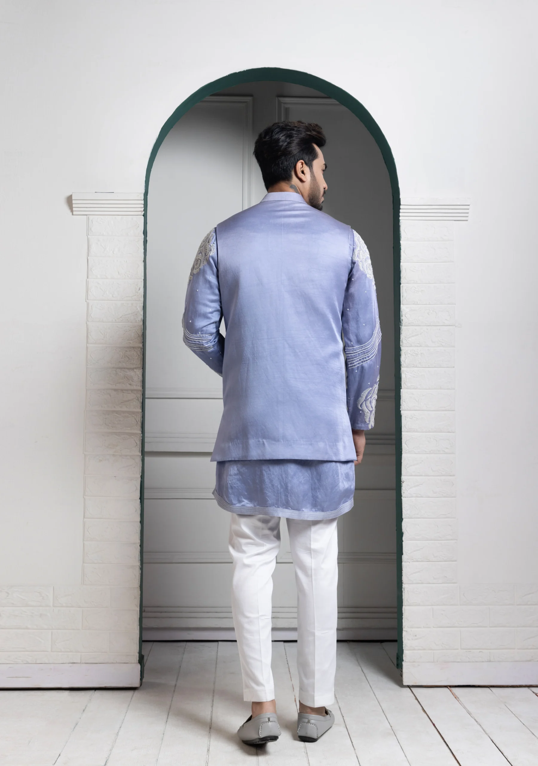 Golden Muslin Pastel Blue Embroidered Silk Kurta Ensemble with ivory waistcoat and white slim-fit trousers
