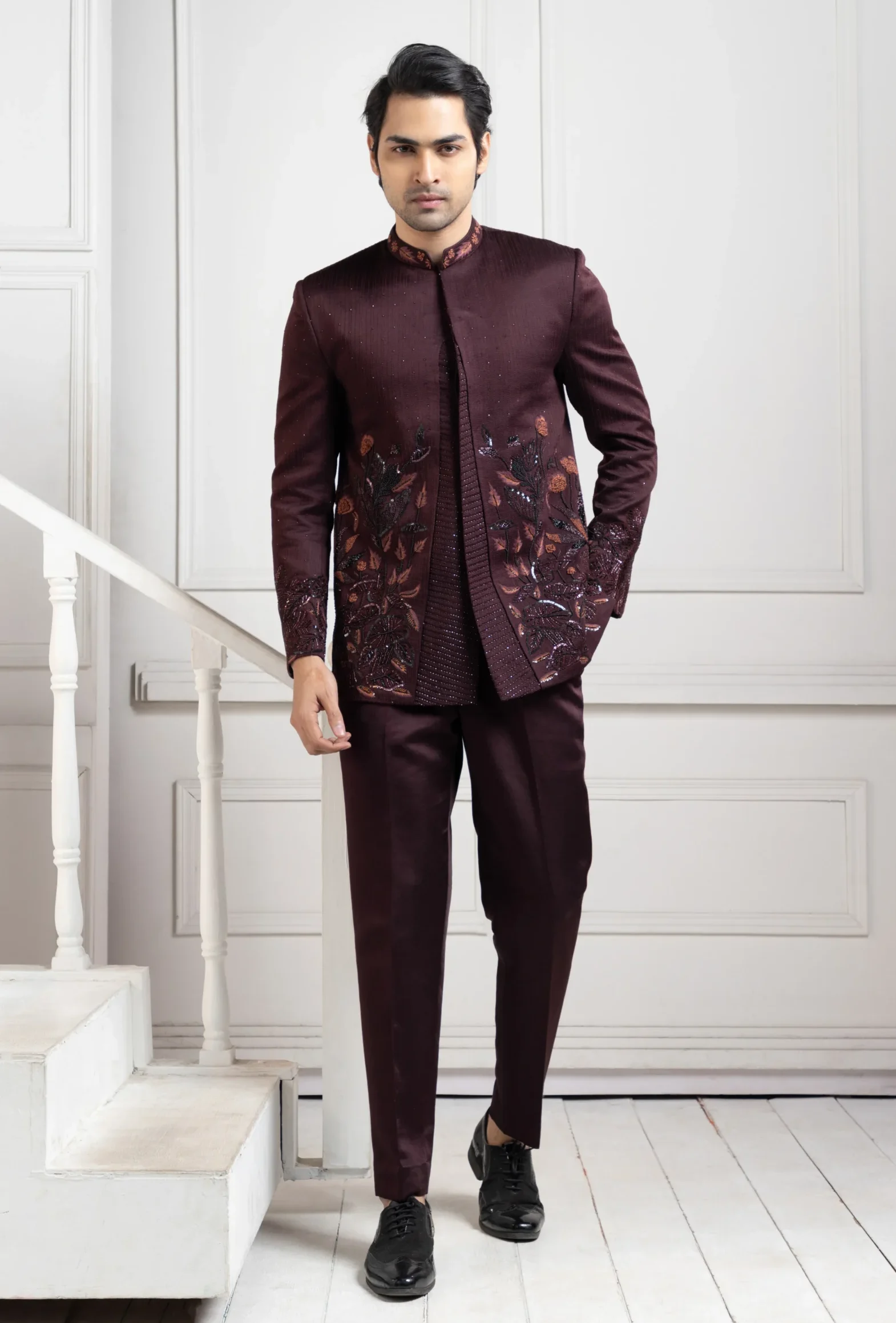 Golden Muslin wine embellished Bandhgala set with tonal embroidery and 3D floral applique detailing paired with tailored trousers