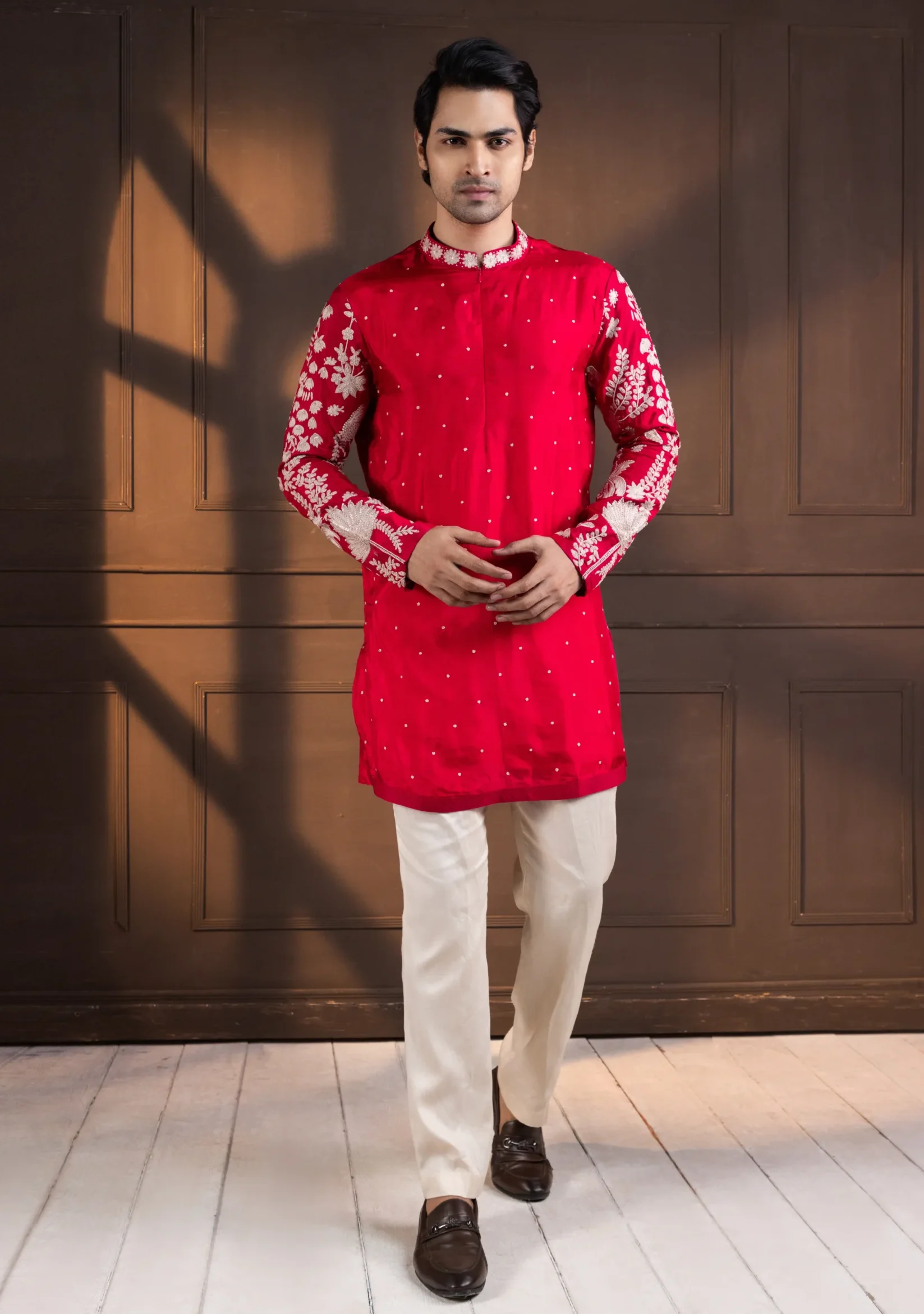 Golden Muslin Crimson Embroidered Kurta Set with ivory floral sleeve detailing and off-white trousers