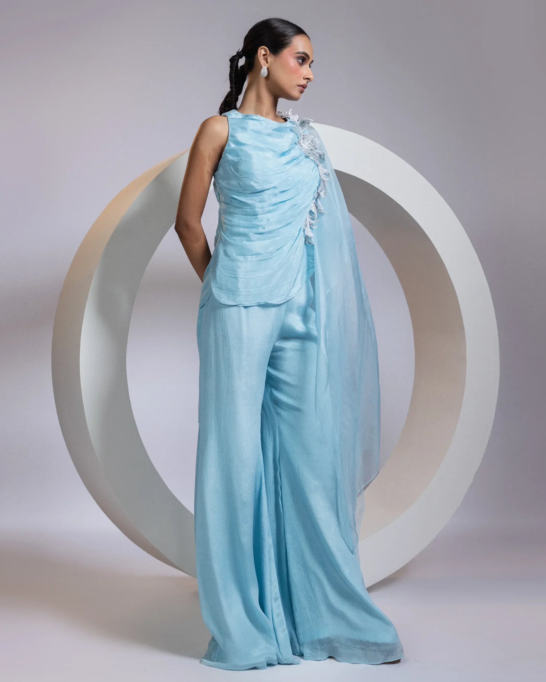 Floral appliqué draped top with cape panel and palazzo pants from Golden Muslin By Anuj Agarwal