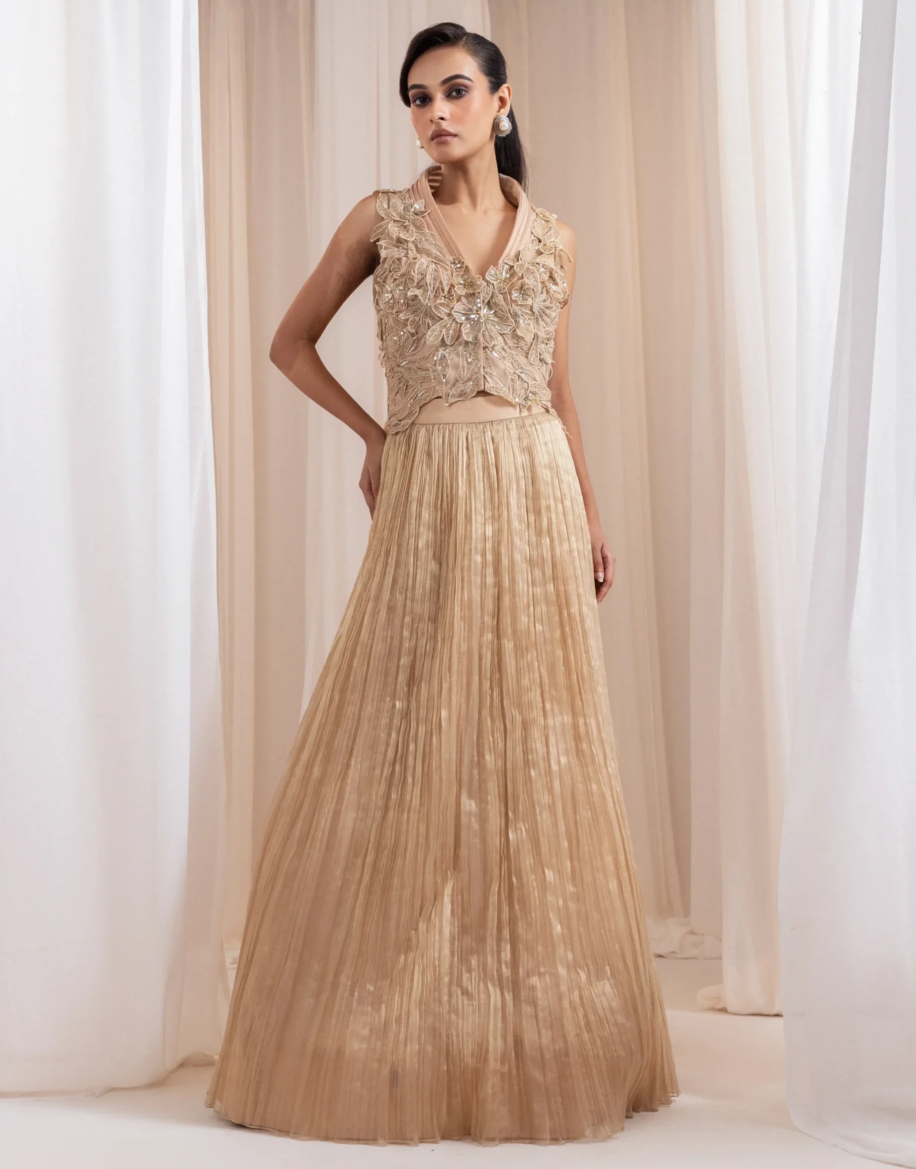 Champagne lehenga set with 3D floral appliqué and pleated net skirt from Golden Muslin By Anuj Agarwal