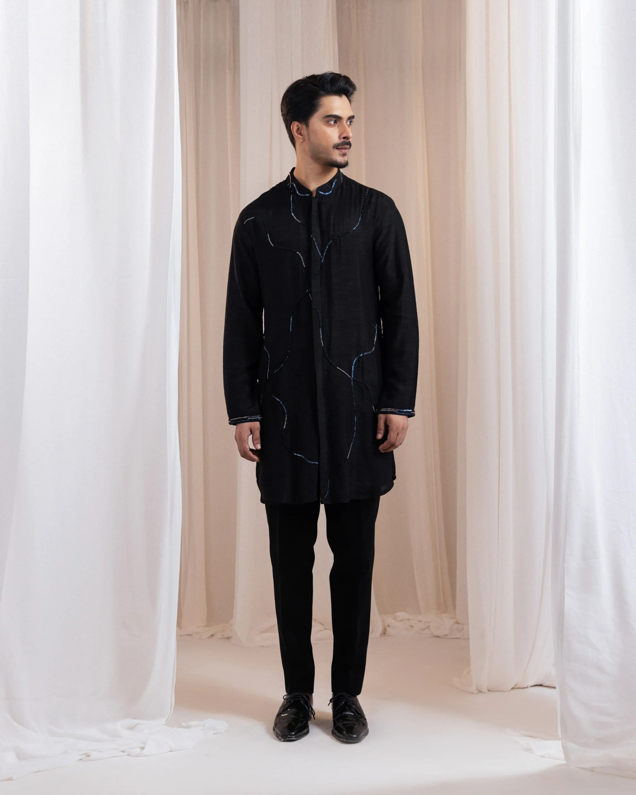 Black Kurta with Abstract Wave Embroidery and Metallic Detailing from Golden Muslin By Anuj Agarwal