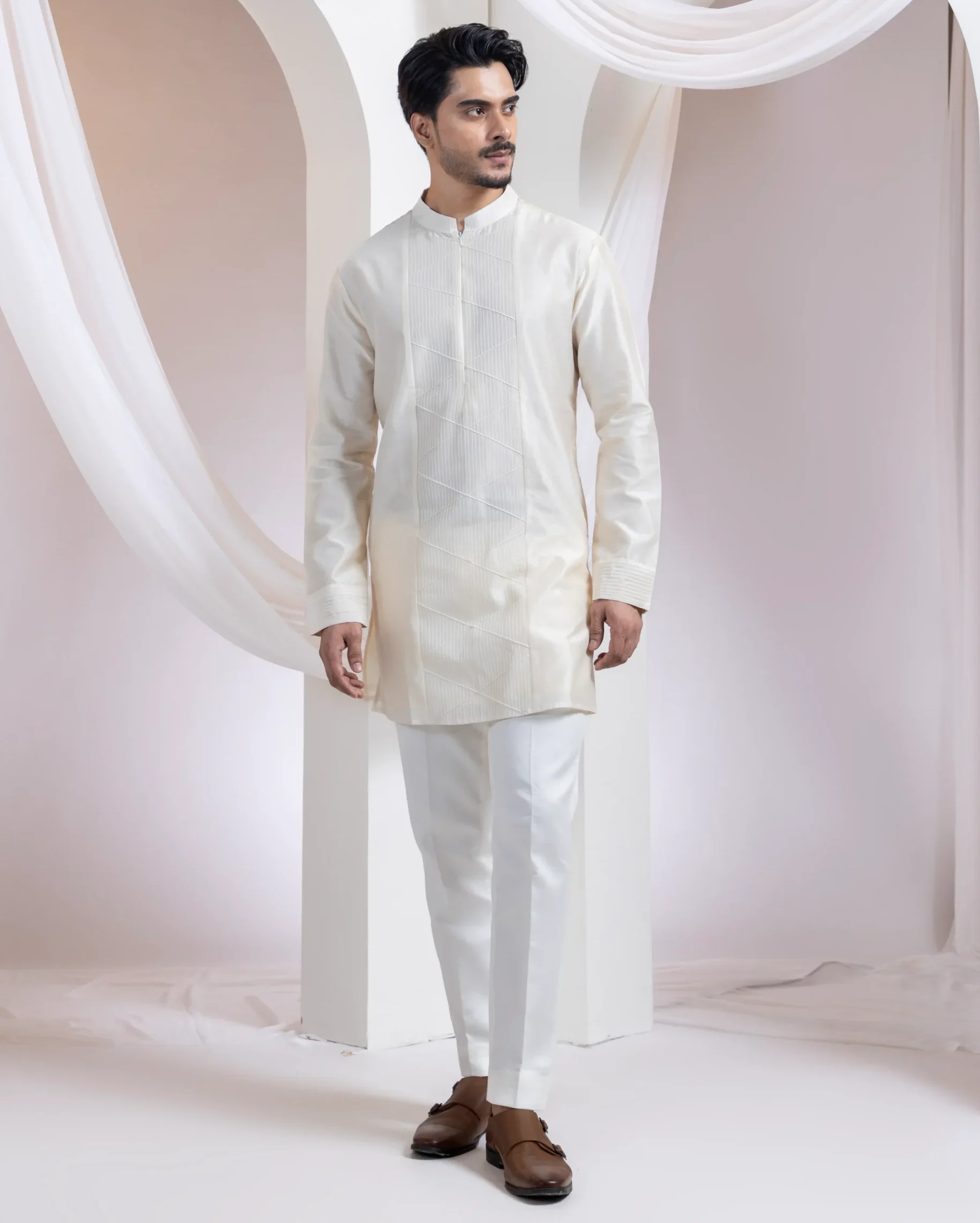 Ivory straight kurta set with tone-on-tone geometric embroidery from Golden Muslin By Anuj Agarwal