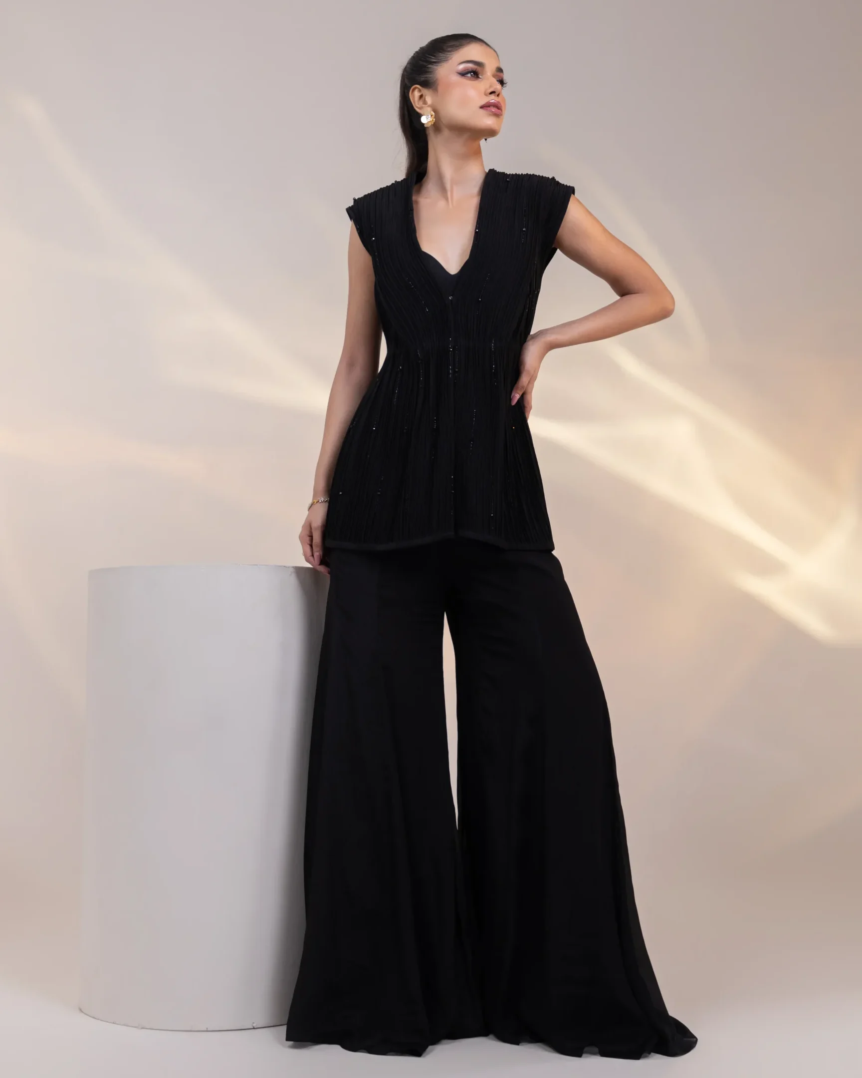 Midnight Black Three Piece Bustier Set with Pleated Tailored Overlay and Flared Pants from Golden Muslin By Anuj Agarwal