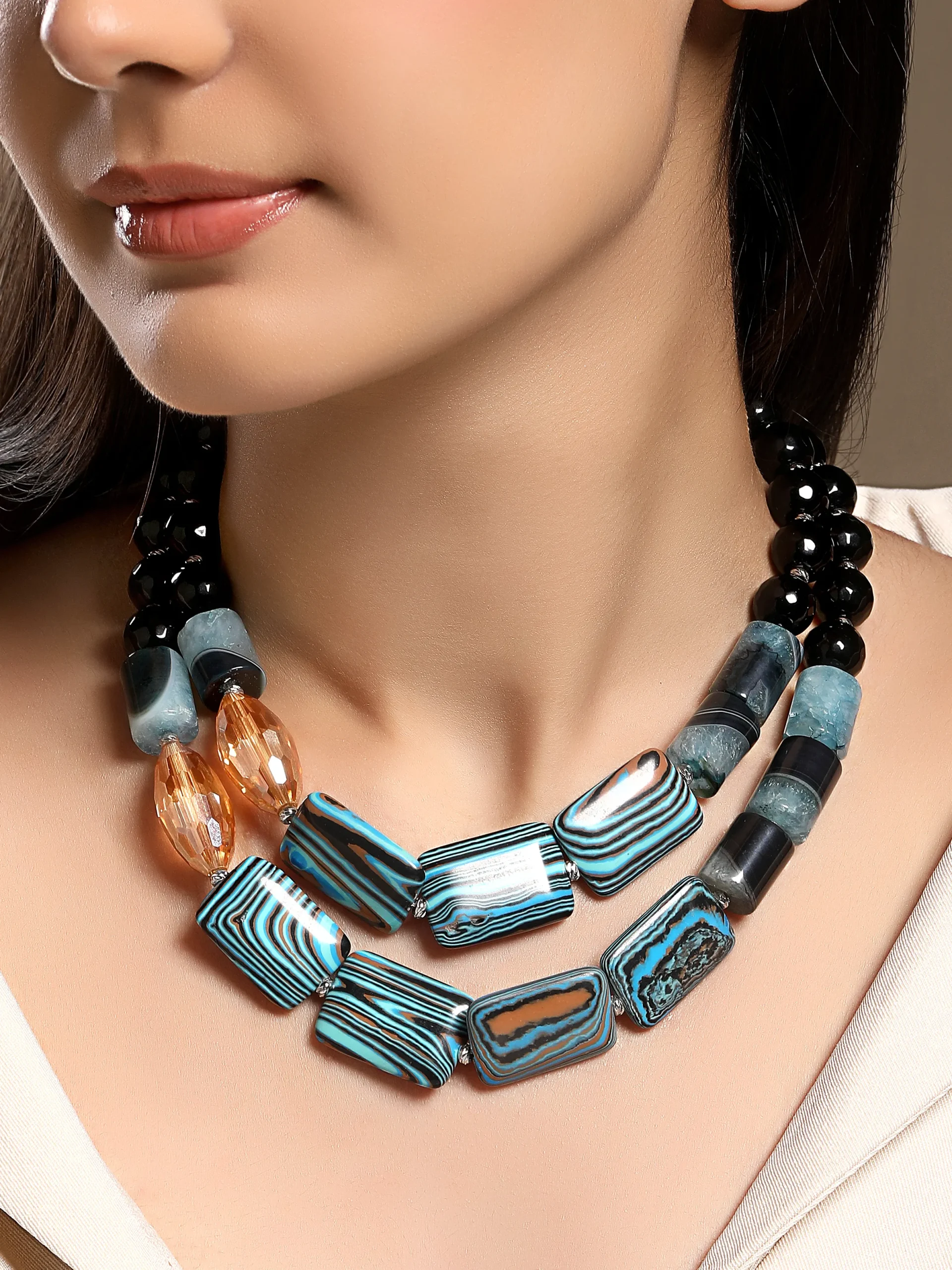 Blue agate and black onyx statement necklace in micron gold polished brass from Golden Muslin By Hrisha