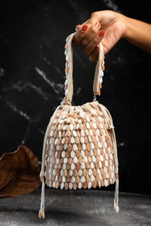 Cream & Peach Gold Beaded Tassel Potli with Intricate Handcrafted Work