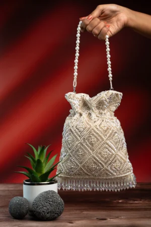 Off White Modish Potli with Criss-Cross Delicate Pearl Embellishment