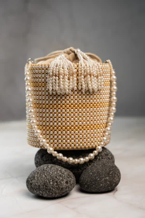 Off White Cylindrical Potli with Gold Beads and Intricate Pearl Work