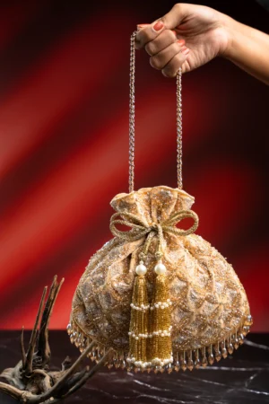 Blush Tinted Gold Velvet Potli with Hand Embroidery and Crystal Fringe Detail