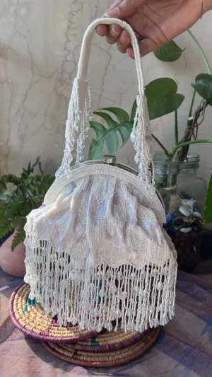 Off White Half Frame Clutch with Pearl and Crystal Tassel Embellishments