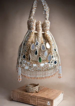 Ivory Mirror and Abla Work Potli with Pearl Finish and Tassel Detail