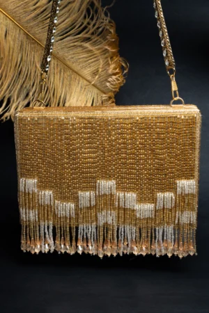 Gold Salli Work Potli with Diamond-Studded Handle and Matching Tassels