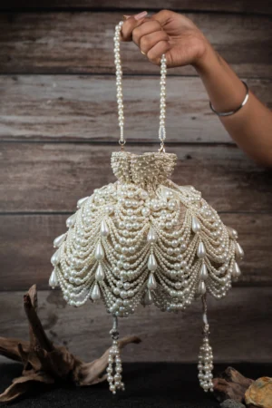 Gold Oyster Pearl Potli Bag with Layered Pearls and Tassel Drawstring Detail