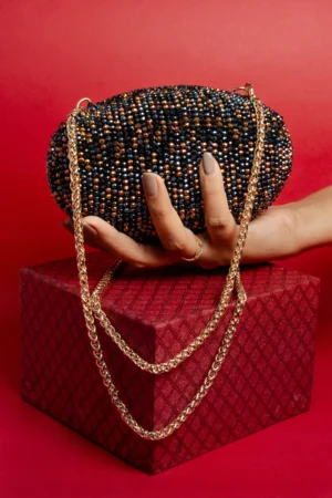 Black & Copper Beaded Oval Clutch with Crossbody Chain and Luxe Finish